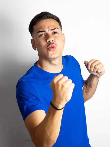 Dudu Footz striking a boxing pose for the camera, joking around